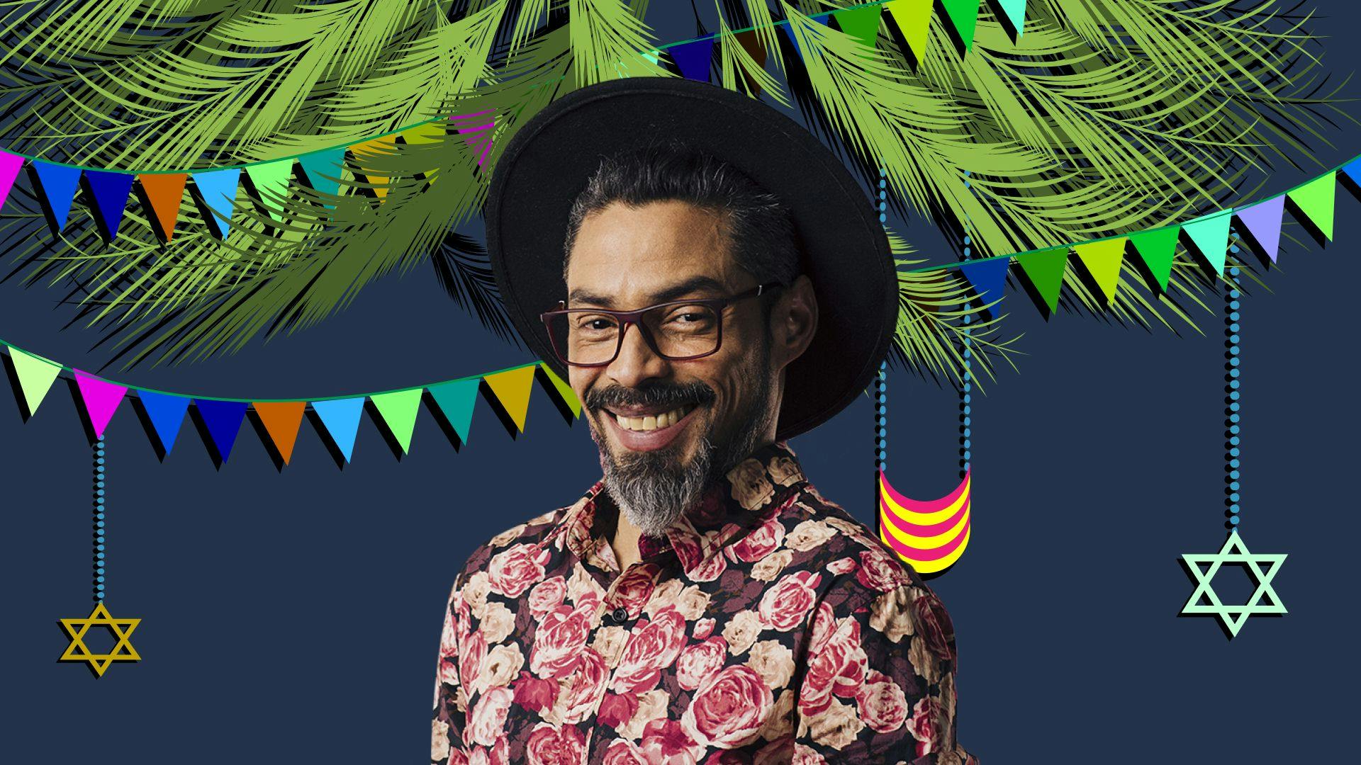 Smiling man with glasses against Sukkot background with flags, stars of David, and plant materials