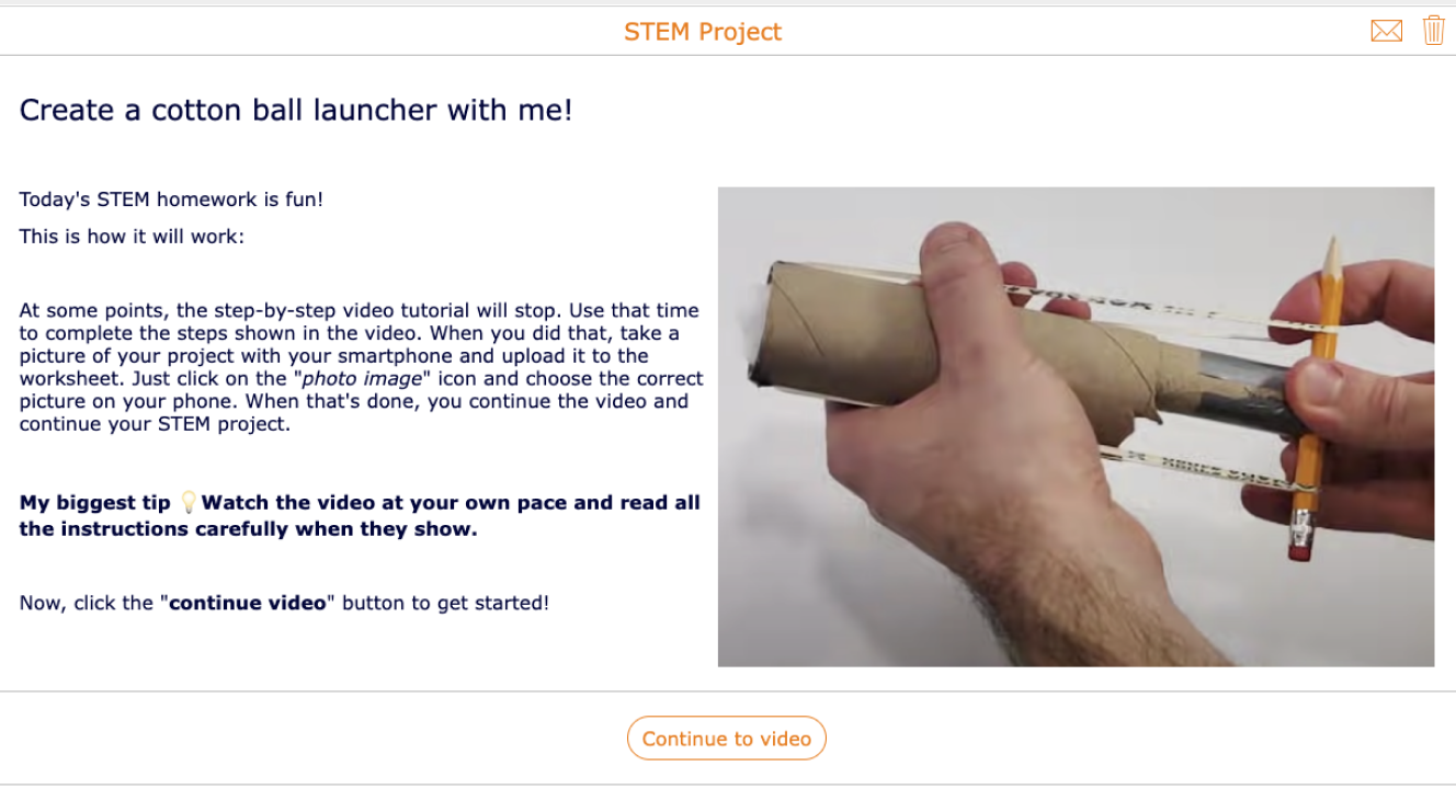 Image of Stem project on creating a cotton ball launcher hand holding a project