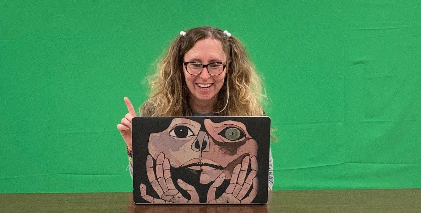 Lorrie Salome sitting in front of a green screen