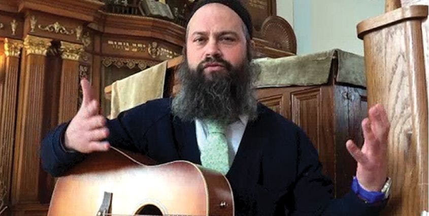 Rabbi Yossi with his guitar