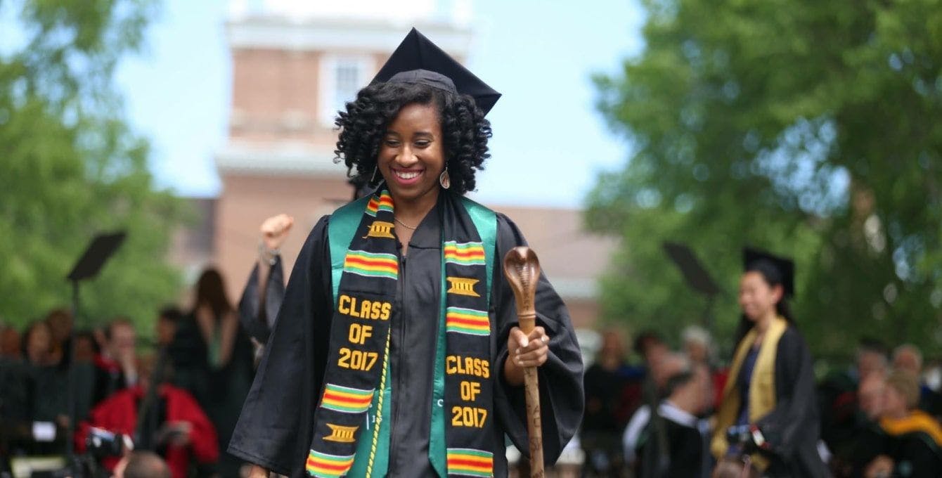 Kaya Thomas wears a cap and gown at her 2017 graduation from Dartmouth College.